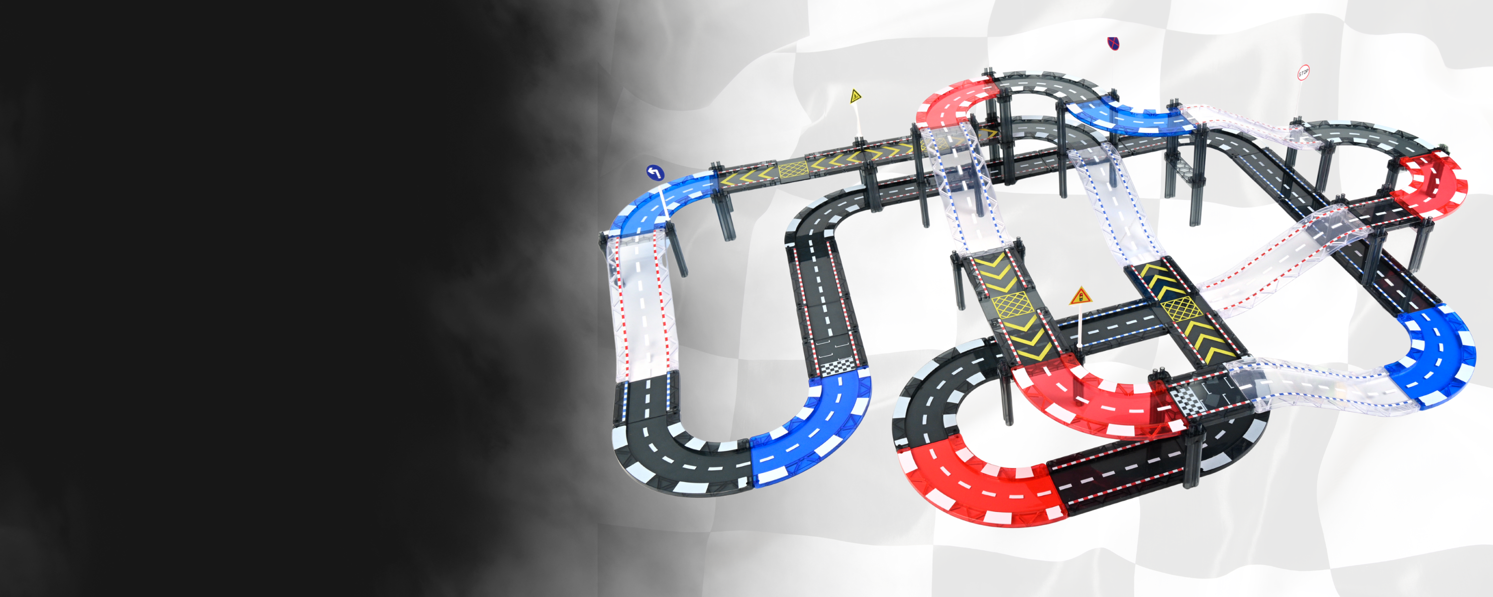 Toy car track set with multiple loops and turns on a white background